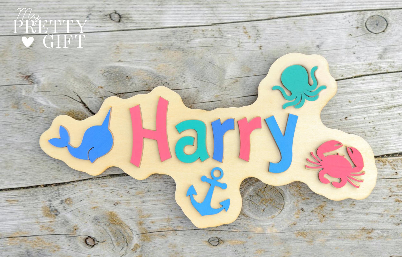 Personalised wooden name plaque for kids bedrooms or nursery rooms, featuring a lovely nauticle  theme. Customised with your child’s name, with the name  Available in different colour options and ideal as a baby shower, birthday, or nursery gift.