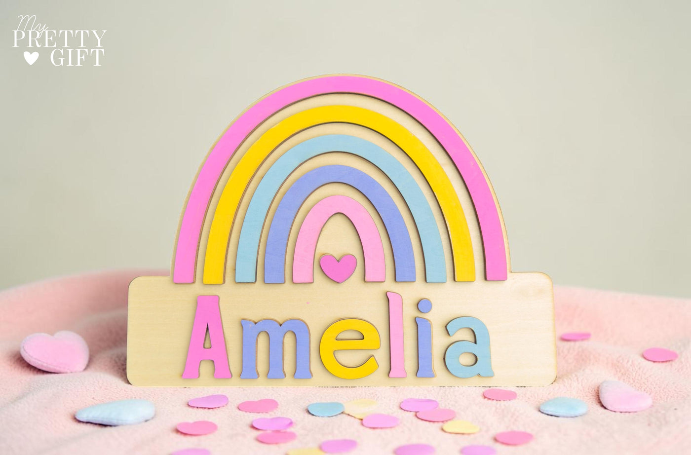 Personalised wooden name plaque for kids bedrooms or nursery rooms, featuring a lovely rainbow  theme. Customised with your child’s name, with the name  Available in different colour options and ideal as a baby shower, birthday, or nursery gift.