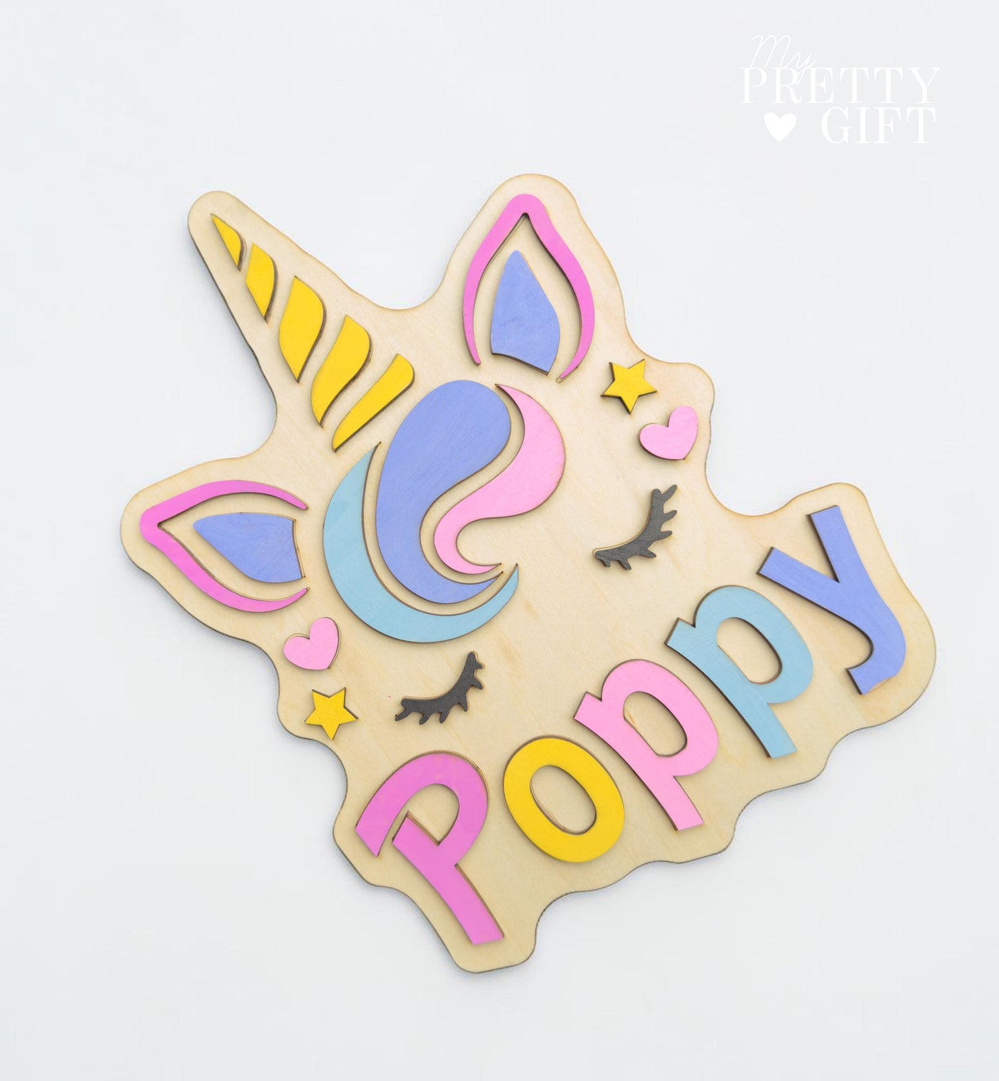 Personalised wooden name plaque for kids bedrooms or nursery rooms, featuring a lovely unicorn  theme. Customised with your child’s name, with the name  Available in different colour options and ideal as a baby shower, birthday, or nursery gift.
