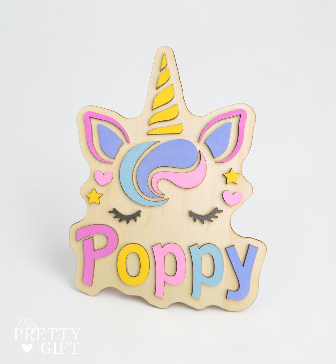 Personalised wooden name plaque for kids bedrooms or nursery rooms, featuring a lovely unicorn  theme. Customised with your child’s name, with the name  Available in different colour options and ideal as a baby shower, birthday, or nursery gift.