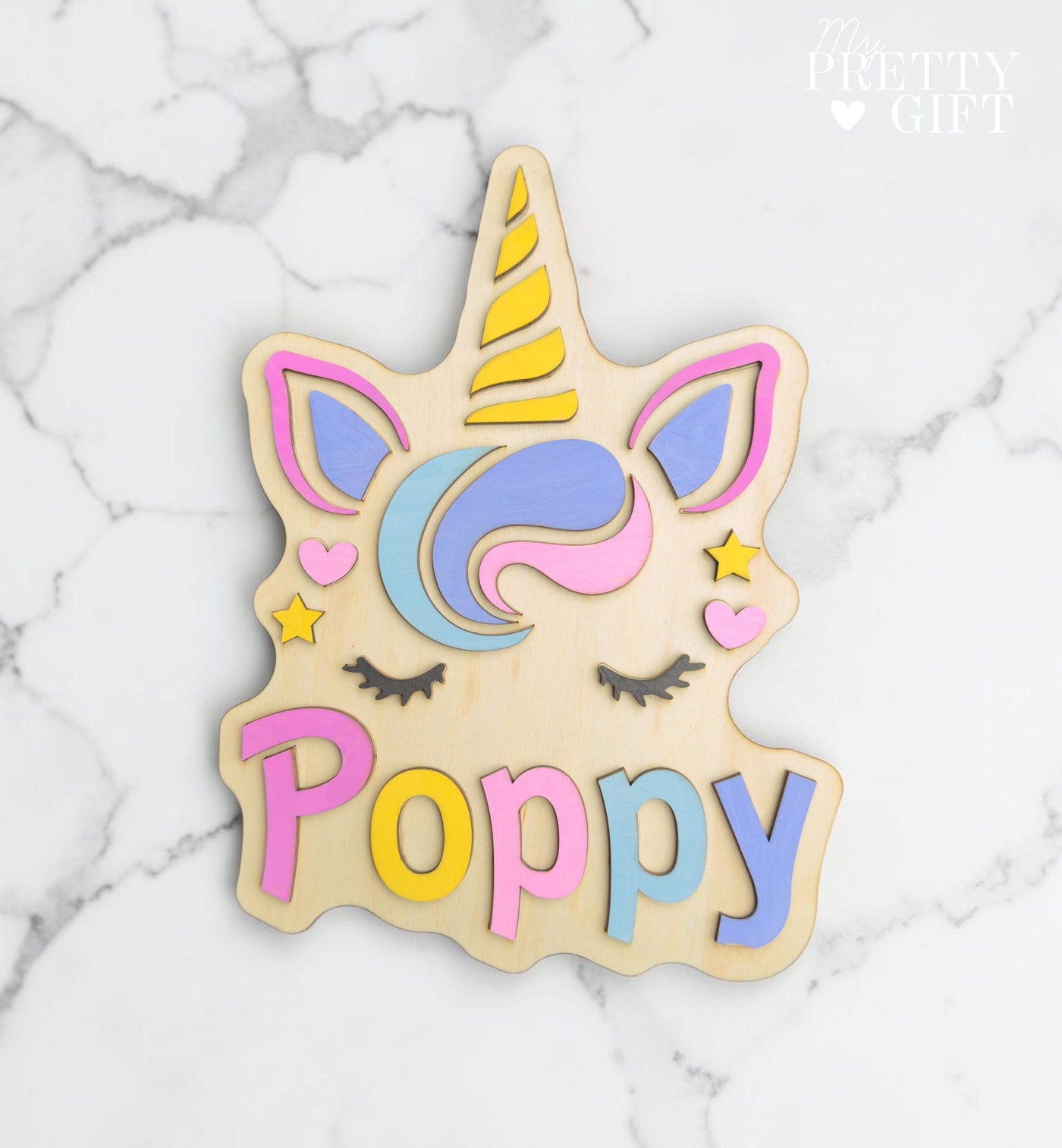 Personalised wooden name plaque for kids bedrooms or nursery rooms, featuring a lovely unicorn  theme. Customised with your child’s name, with the name  Available in different colour options and ideal as a baby shower, birthday, or nursery gift.