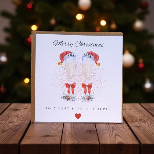 Personalised Couple Christmas Card, Champagne Glasses, Festive Design, Kraft Envelope (6x6 inches)