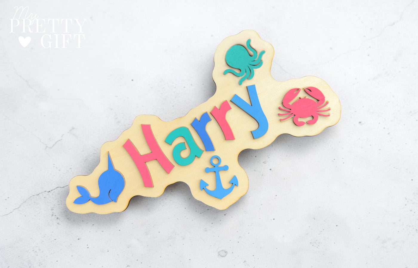 Personalised wooden name plaque for kids bedrooms or nursery rooms, featuring a lovely nauticle  theme. Customised with your child’s name, with the name  Available in different colour options and ideal as a baby shower, birthday, or nursery gift.