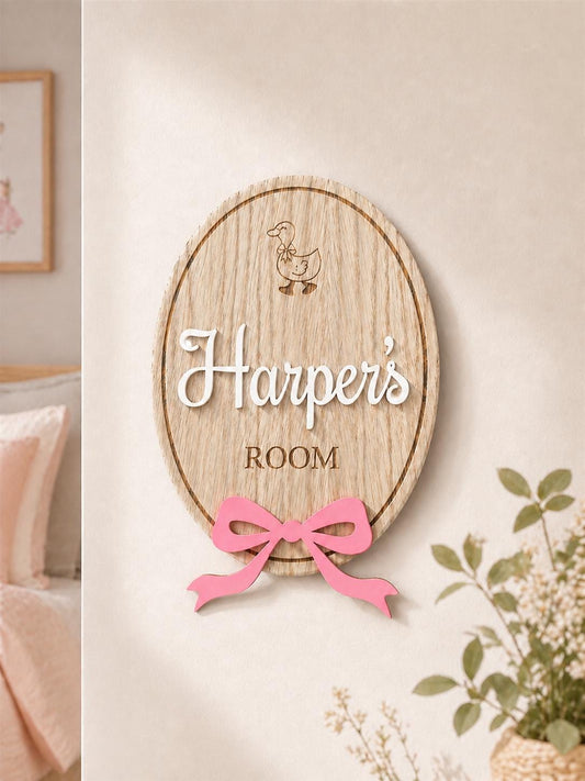Personalised wooden name plaque for kids bedrooms or nursery rooms, featuring a lovely oak veneered finish with laser engraved details. Customised with your child’s name, with the name and bow laser cut from acrylic. Available in different colour options and ideal as a baby shower, birthday, or nursery gift.